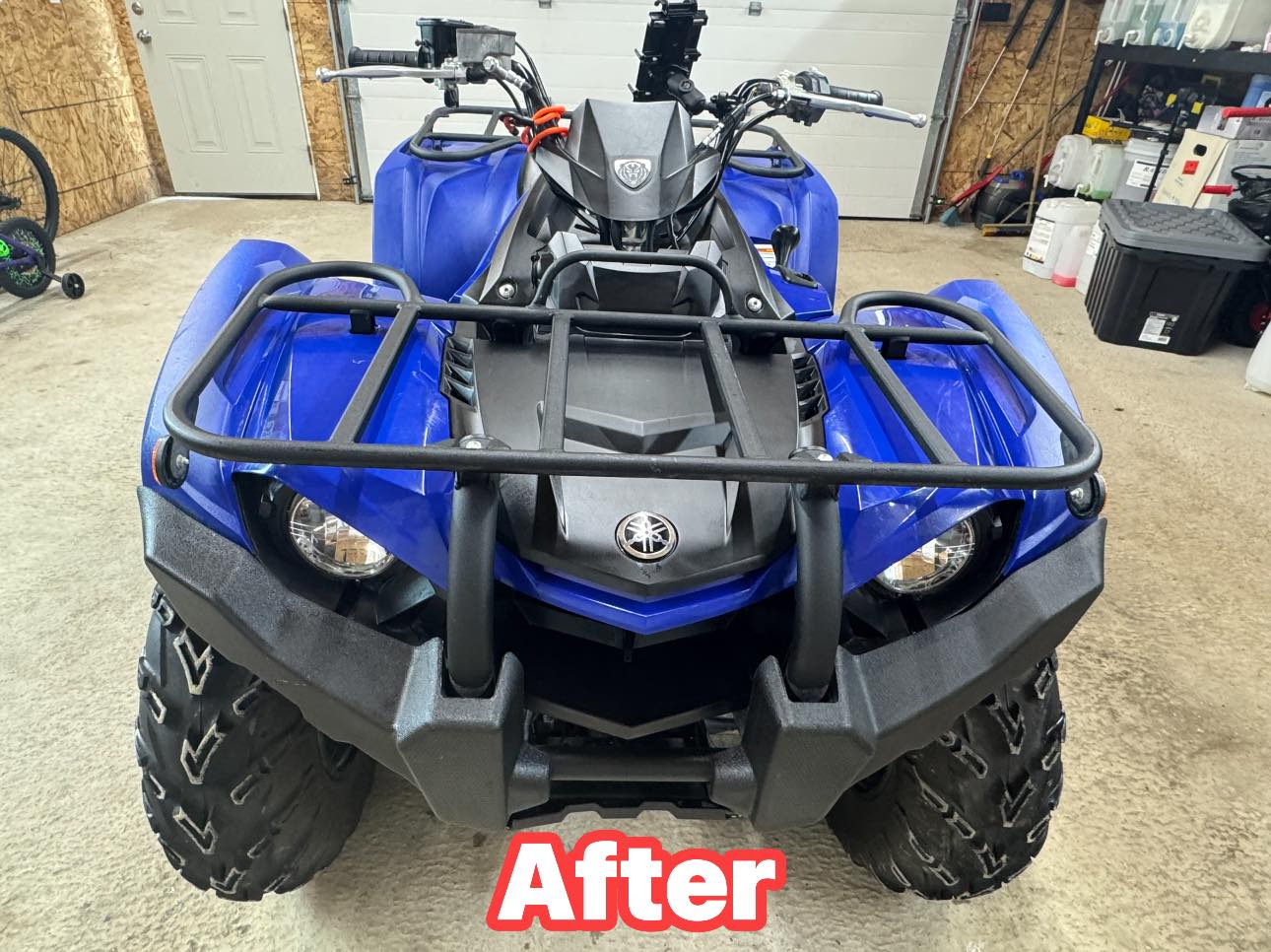 Blue ATV after detailing with a clean, restored finish.