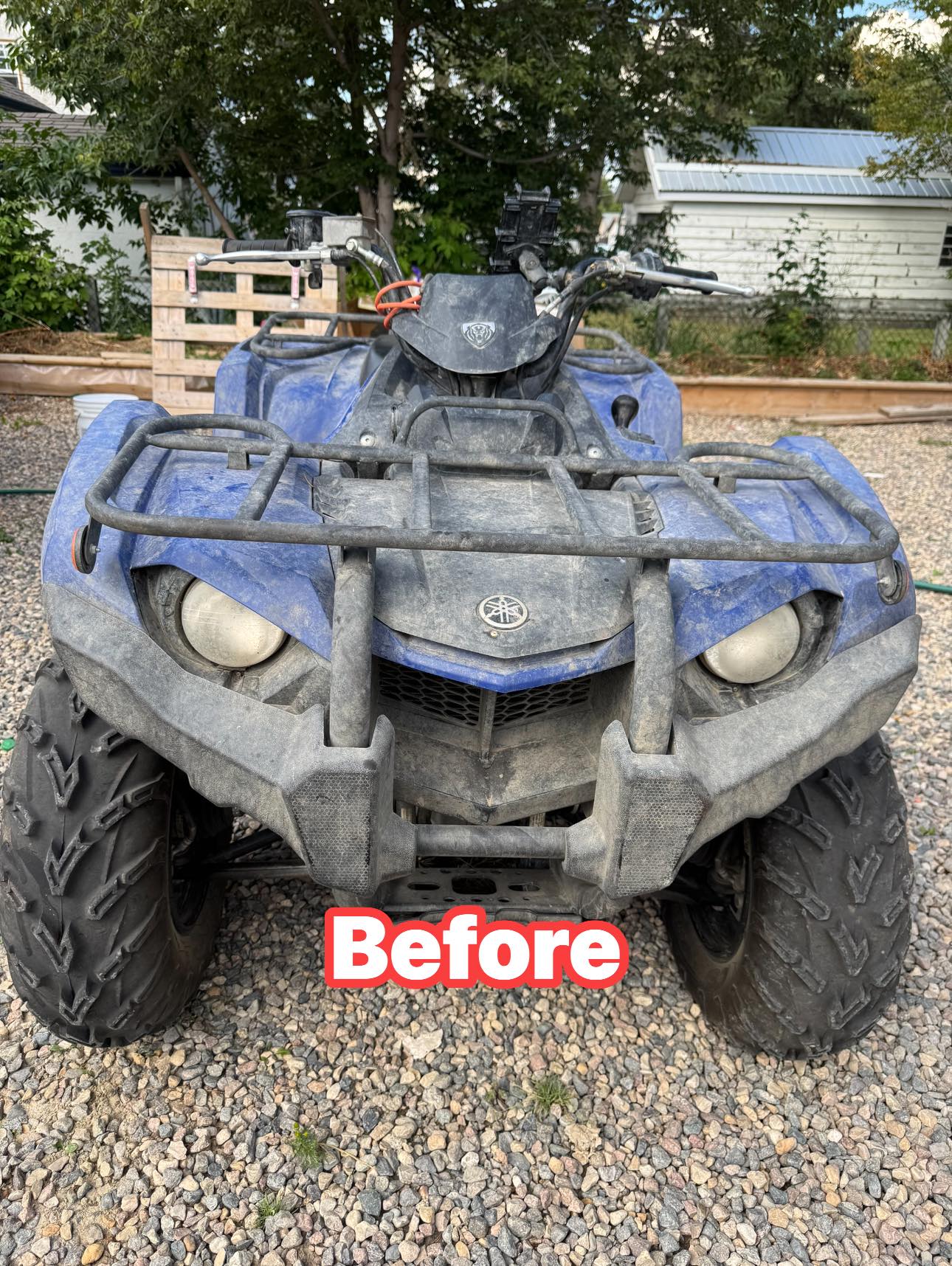 Blue ATV before detailing with visible dirt and dust across the body.