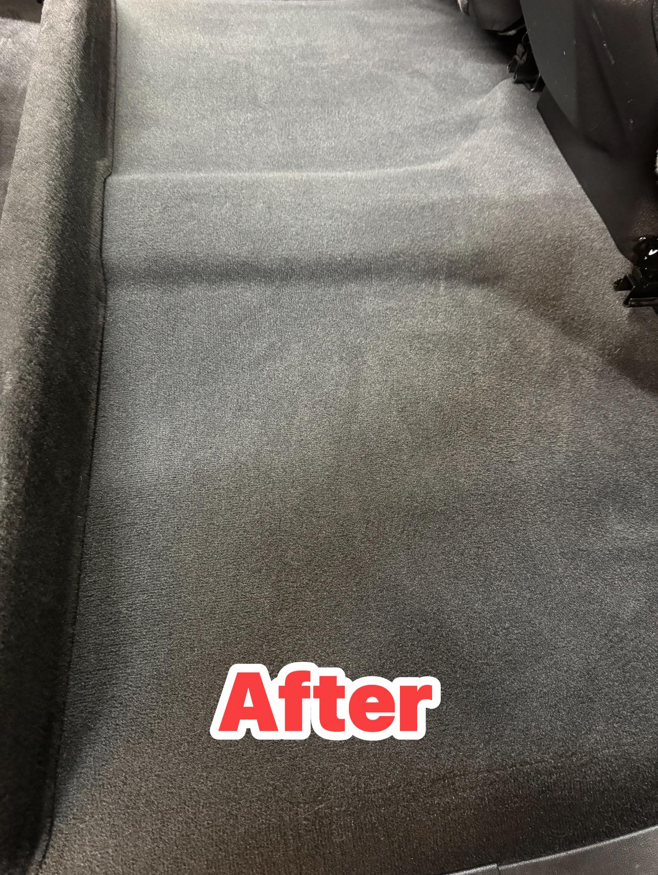 Vehicle carpet after detailing with a clean, restored finish.